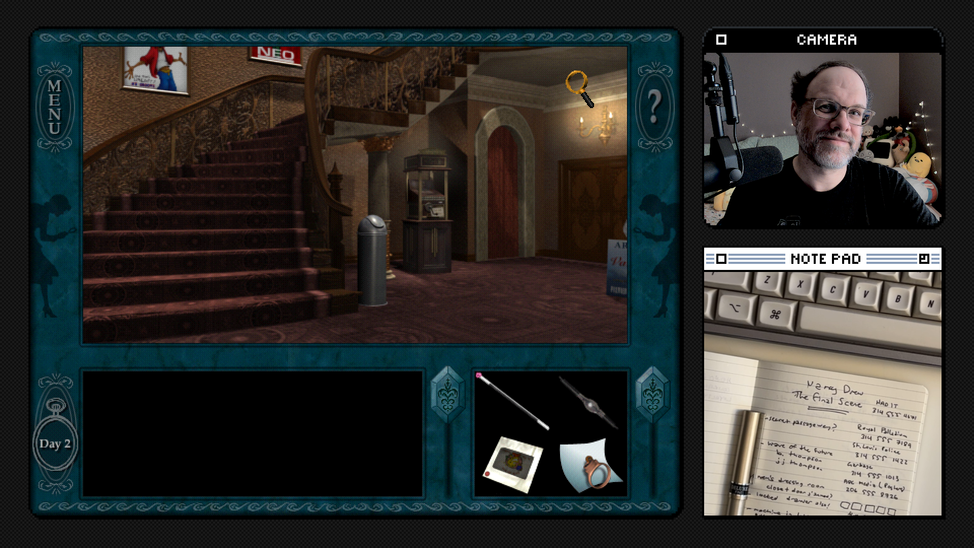 Screenshot of the game, showing a curved staircase in the lobby of an old theater. On the right side are photos of me smiling and an overhead view of my desk with notebook.